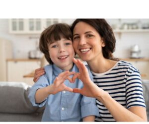 a-mother-and-son-holding-fingers-to-show-the-sign-of-love-for-gentle-parenting