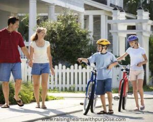 parents-and -children-waking-out-with-bike