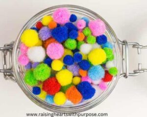 Patriotic-Pom-Pom-Splash-Bin-for-toddlers-in-water