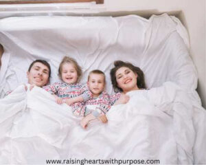 family-covered-with-douve-and-still-on-bed